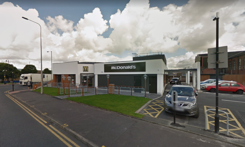 Two staff at a McDonald's in Greater Manchester have tested positive