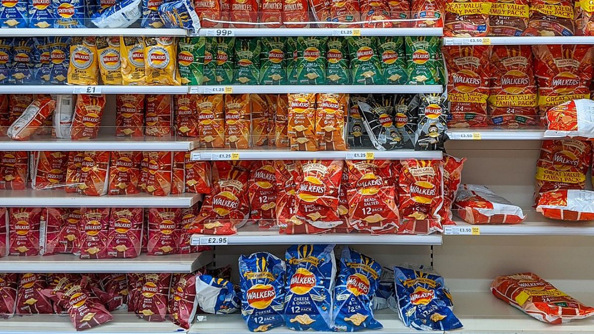 Walkers explains why its cheese and onion crisp packets are blue